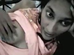 Lying On Her Bed Straight Haired Slim Indian Chick Tries To Show Her Tits